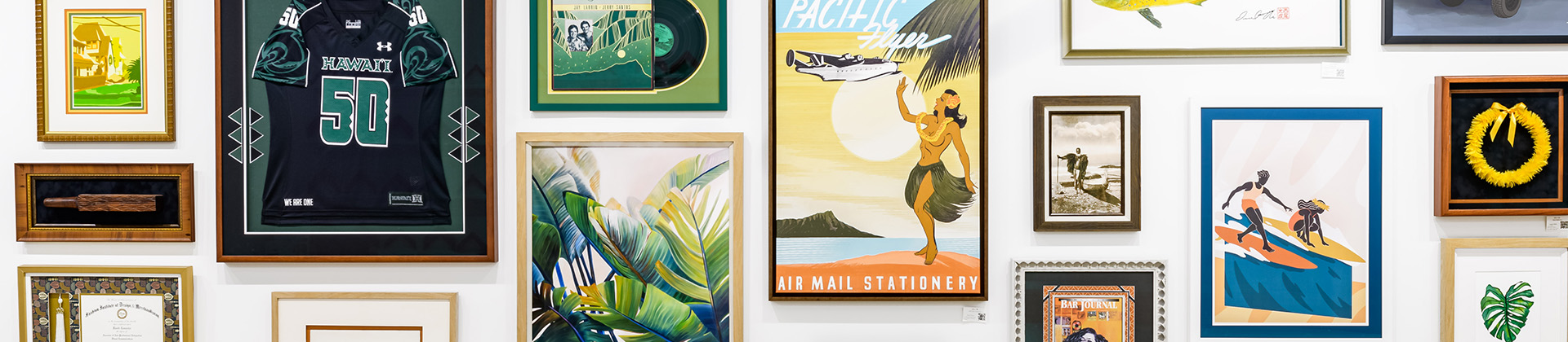 Various print mediums displayed on a wall including metal, canvas, and framed prints