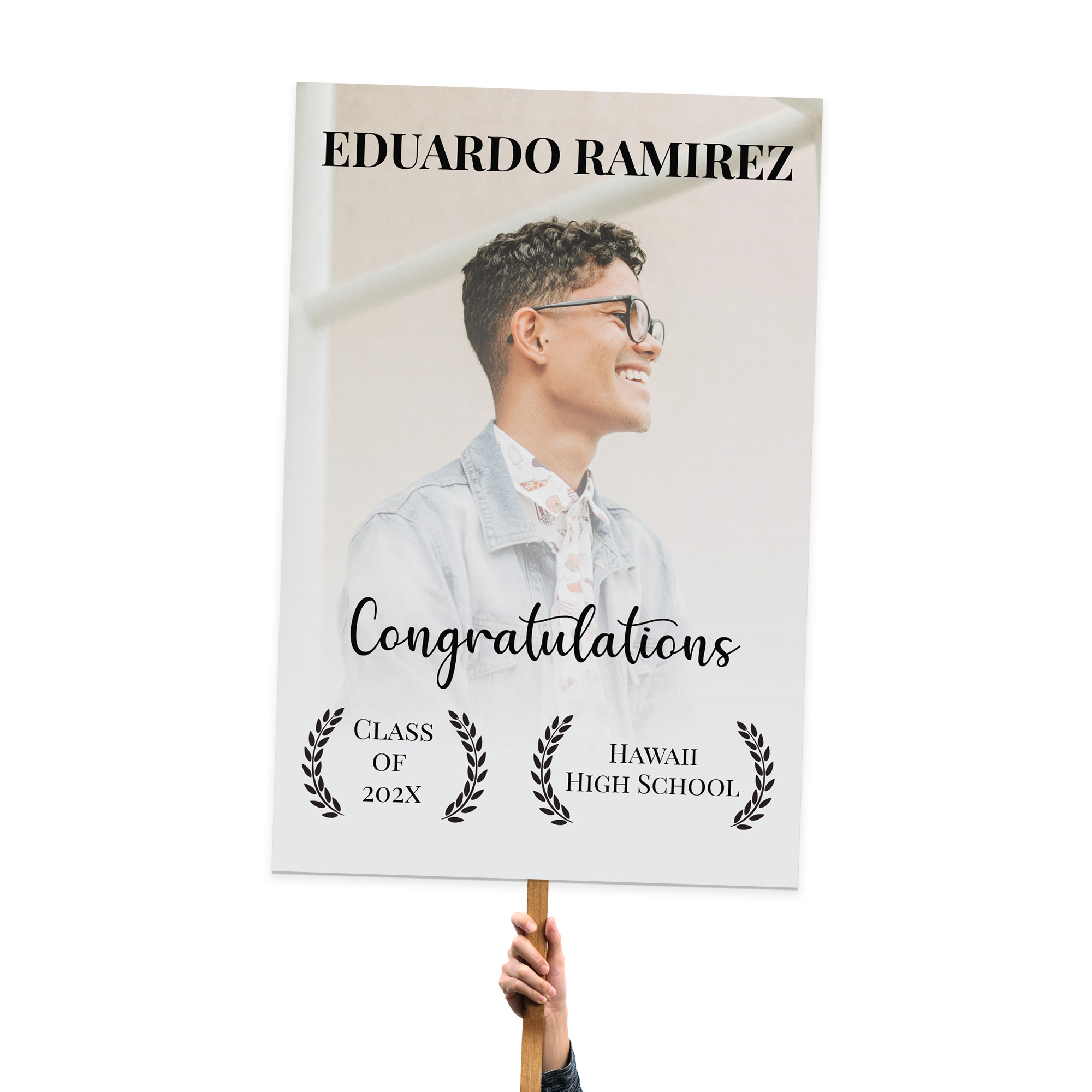 Graduation sign for Eduardo Ramirez, featuring a large photo, school name, and graduation year on foamcore.