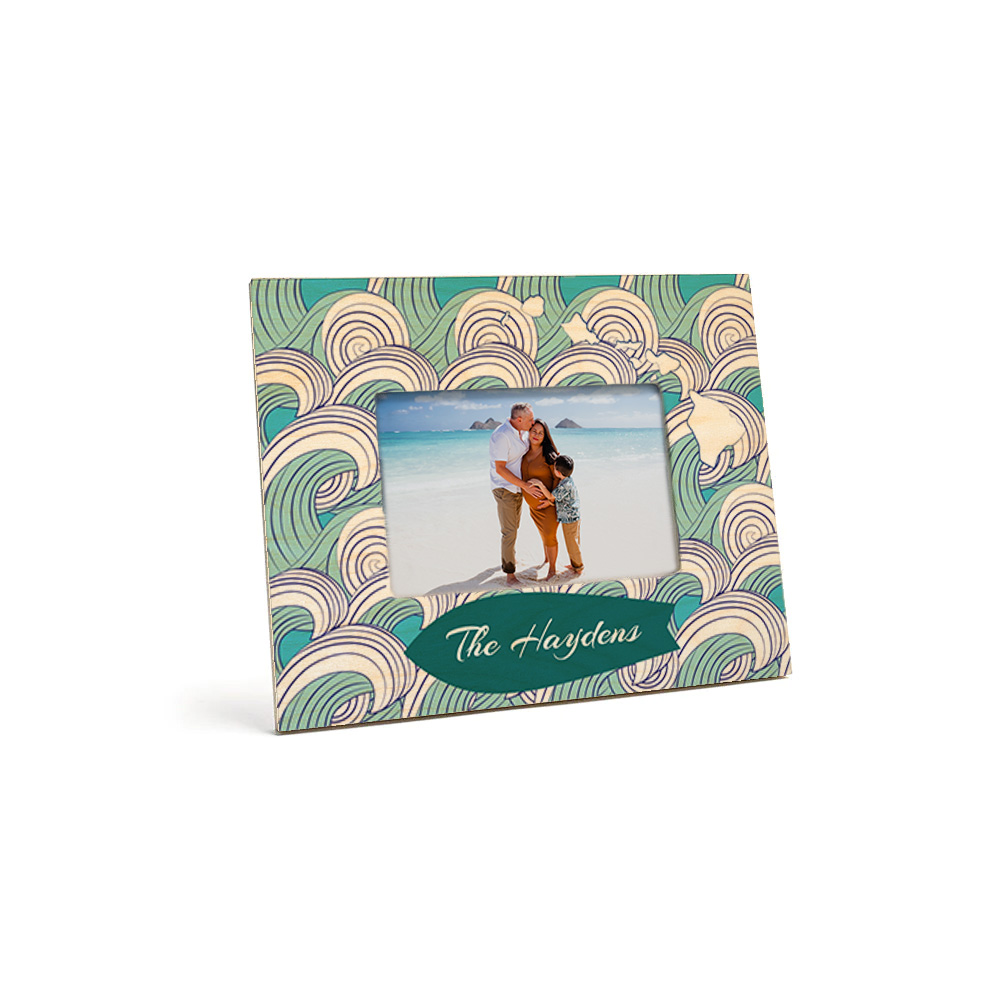 mini wood picture frame decorated with 2 palms, word graduate printed on top holding photo of a graduate & year