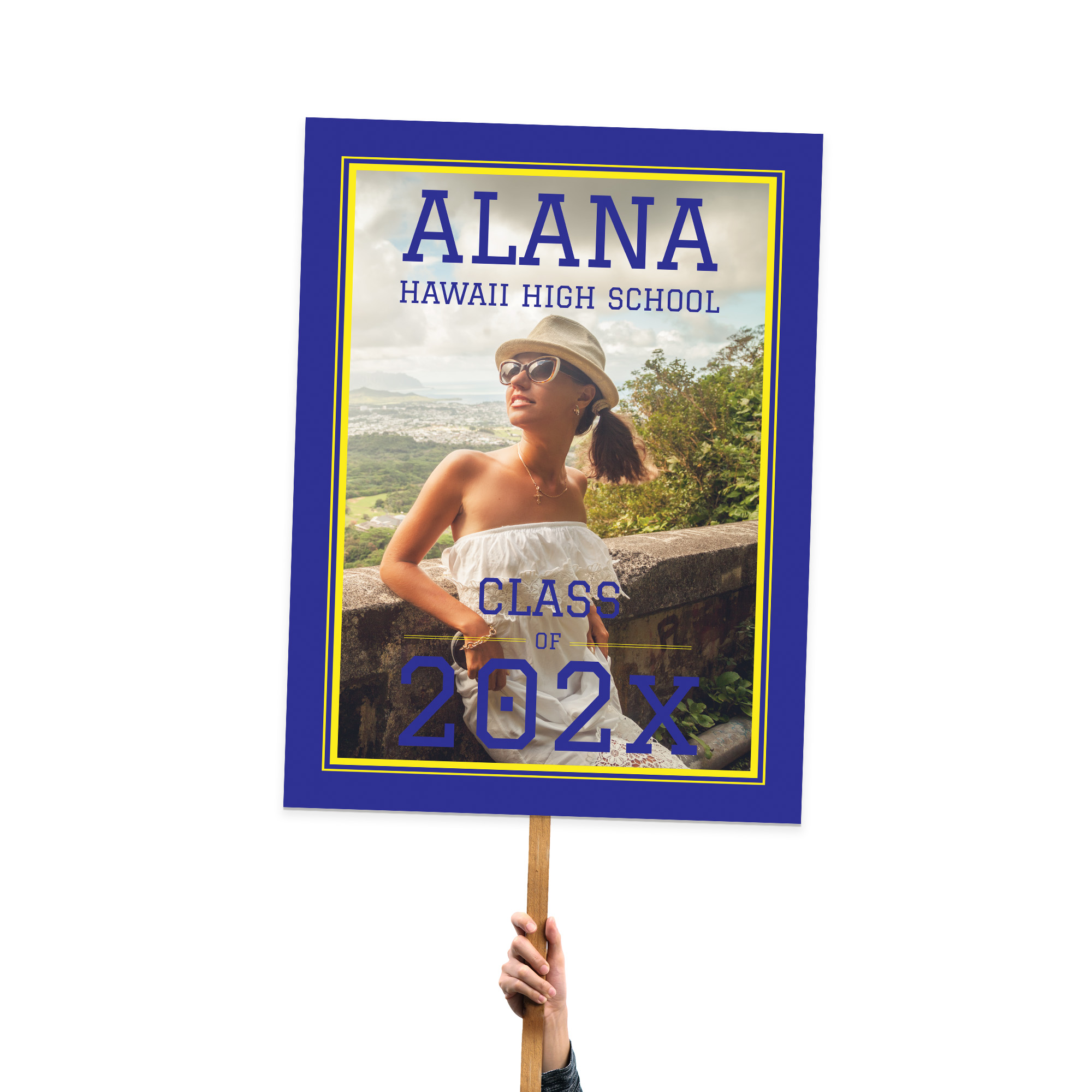 Hawaii high school graduation sign displaying a large photo, school name, and graduation year, showcasing school spirit.